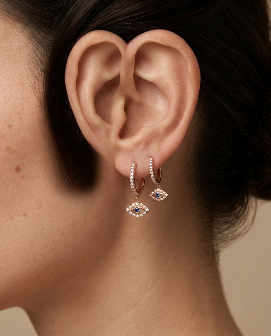 Round Diamond Huggie/Hoop Dangling Evil Eye Earrings in Rose Gold on model