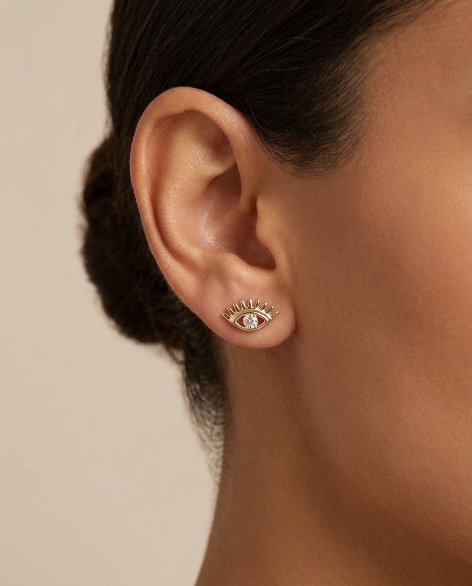Diamond Evil Eye Earrings Studs in Yellow Gold on model