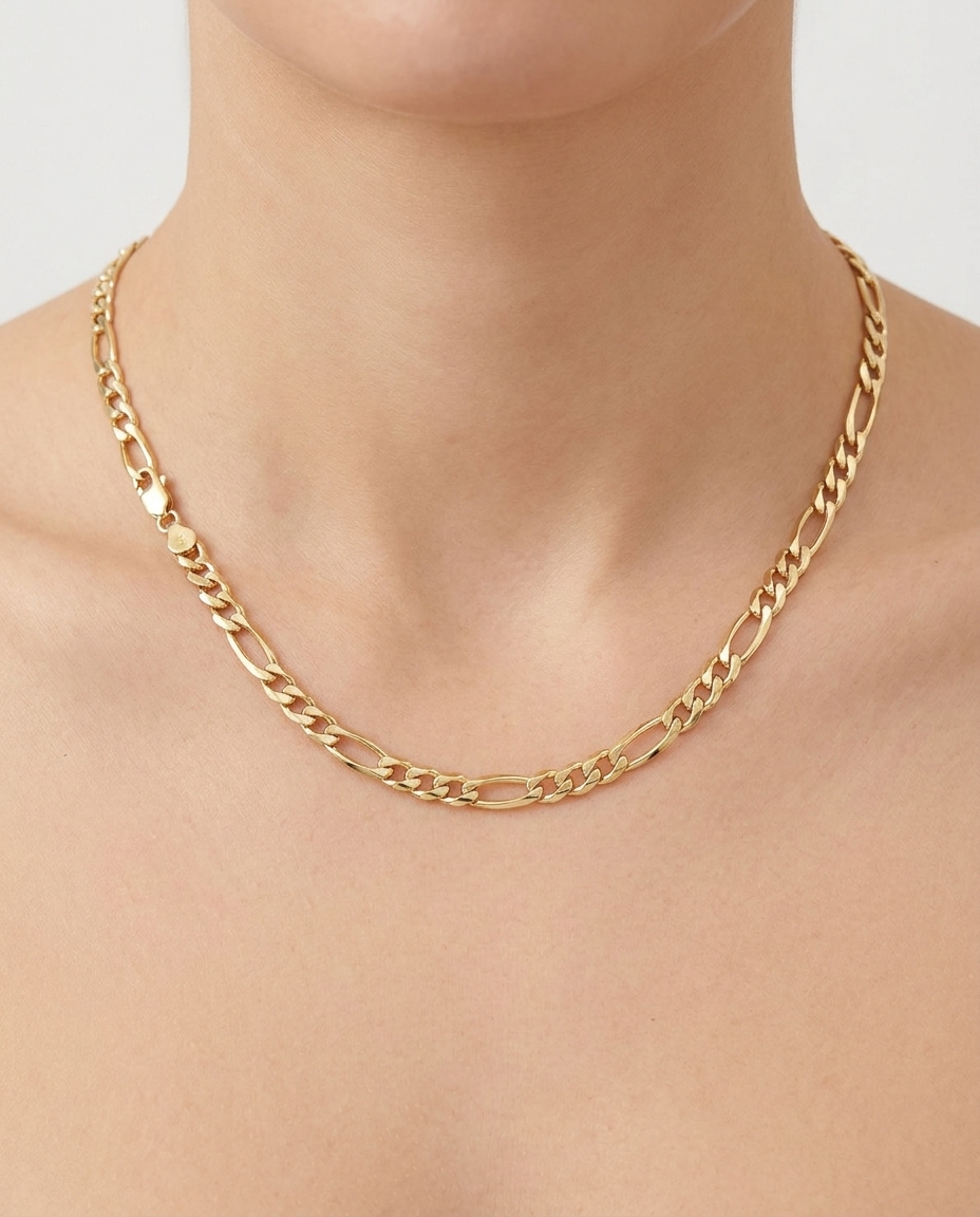 Solid Figaro Chain in Yellow Gold on model