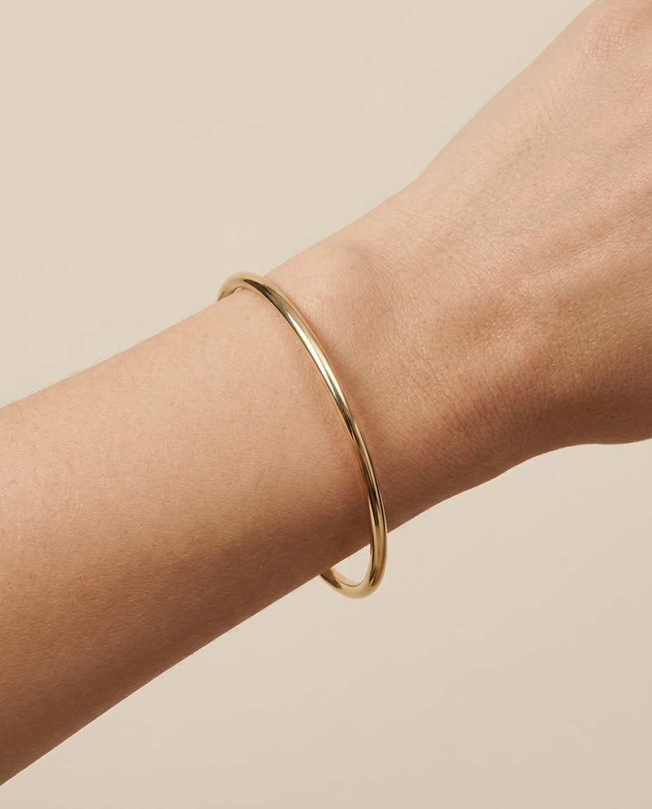 14KT Yellow Gold Hollow Bangle on model