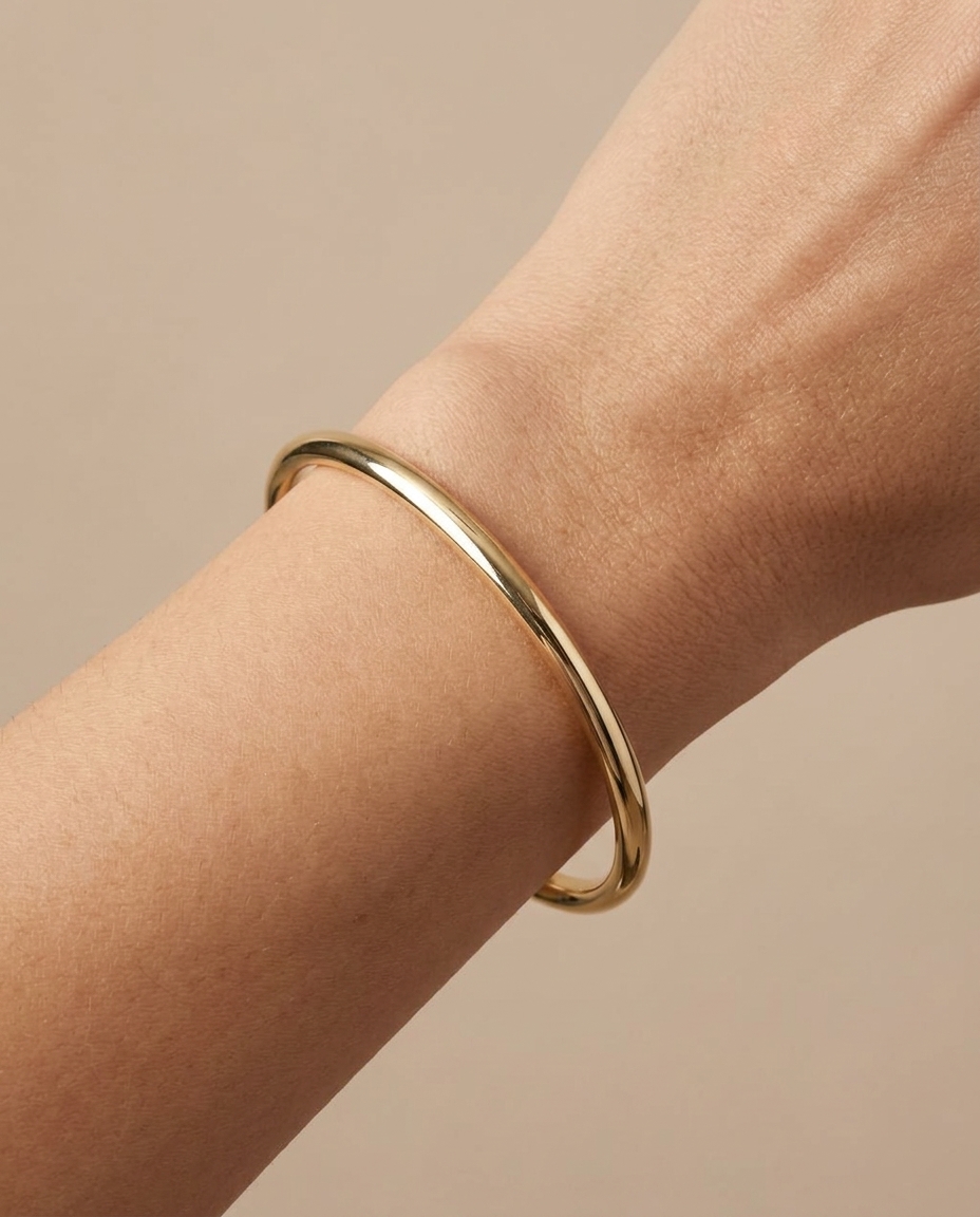 Yellow Gold Hollow Bangle on model