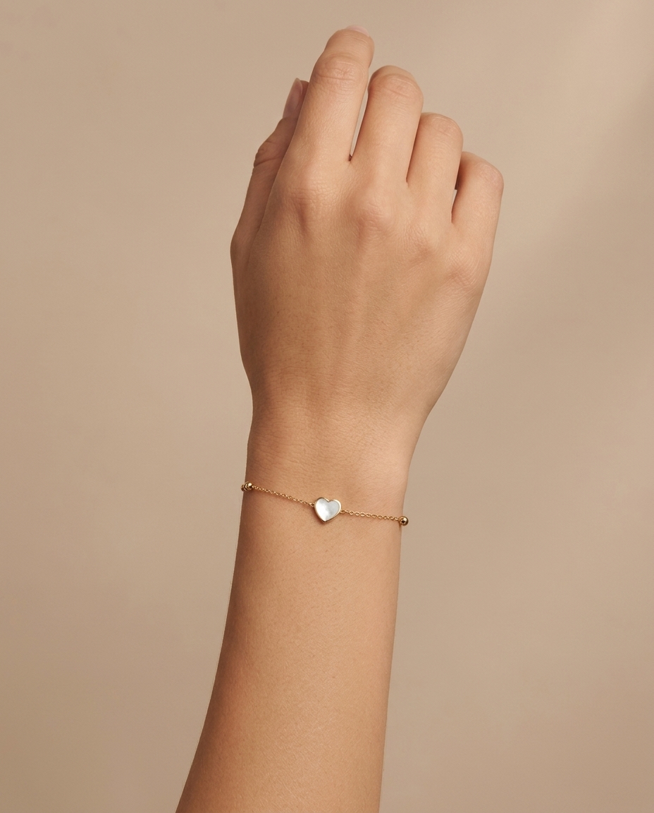 14KT Yellow Gold Mother of Pearl Heart Ball Braclet 7" on model