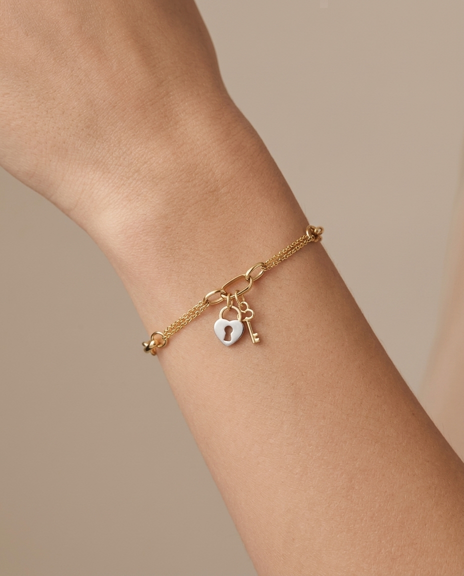 14KT Yellow Gold Enamel Heart Lock and Key Bracelet 7.5" on model