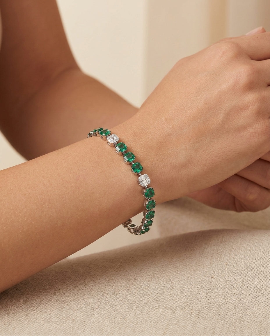 14KT White Gold Emerald and Diamonds Tennis Bracelet on model