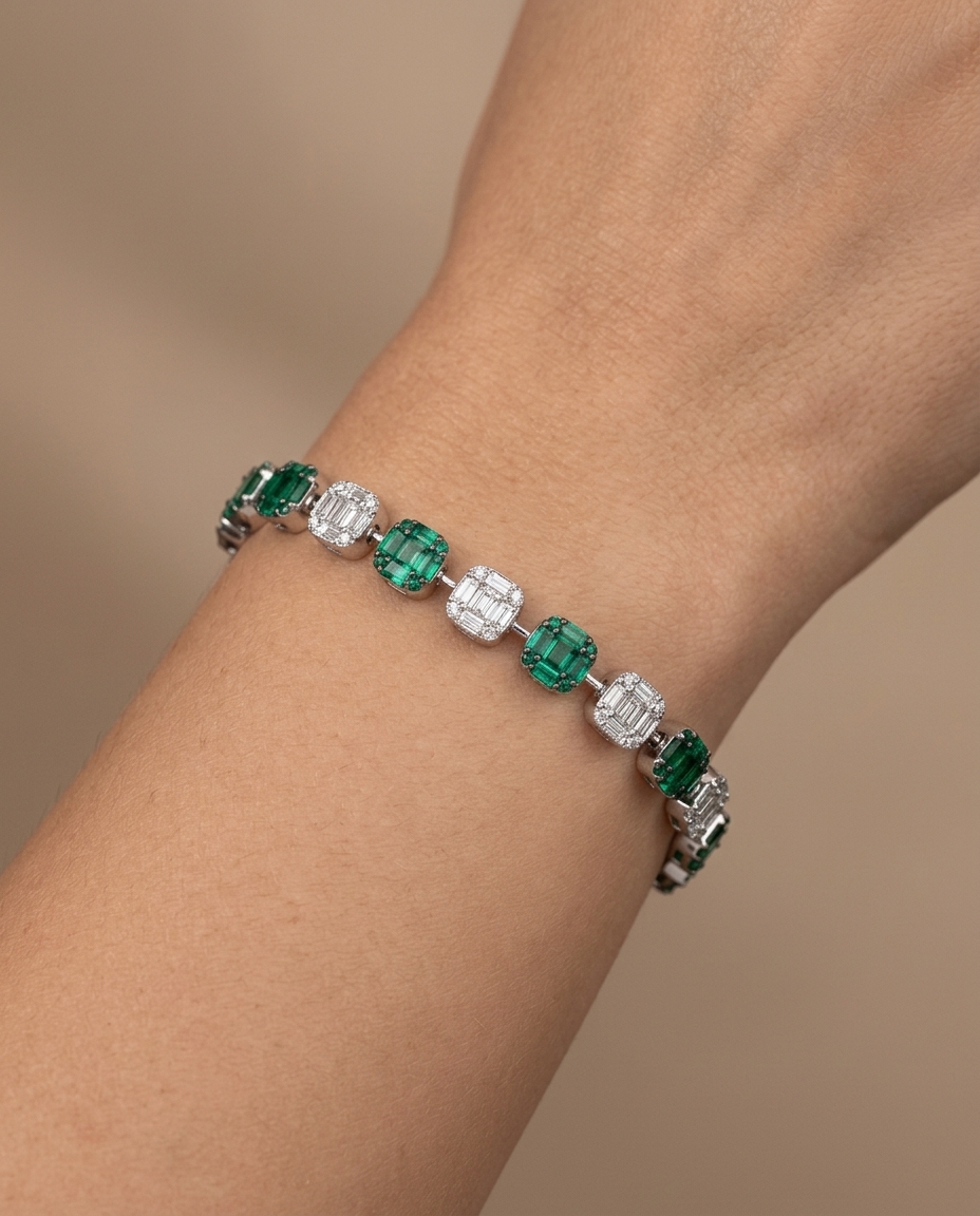 18KT White Gold Emerald and Diamonds Tennis Bracelet on model