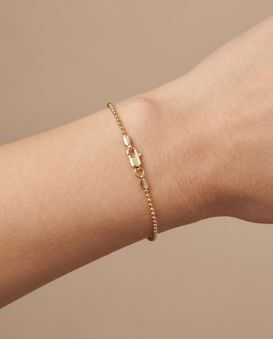 14KT Yellow Gold 1.2 MM Ball Bracelet 7.5" on model