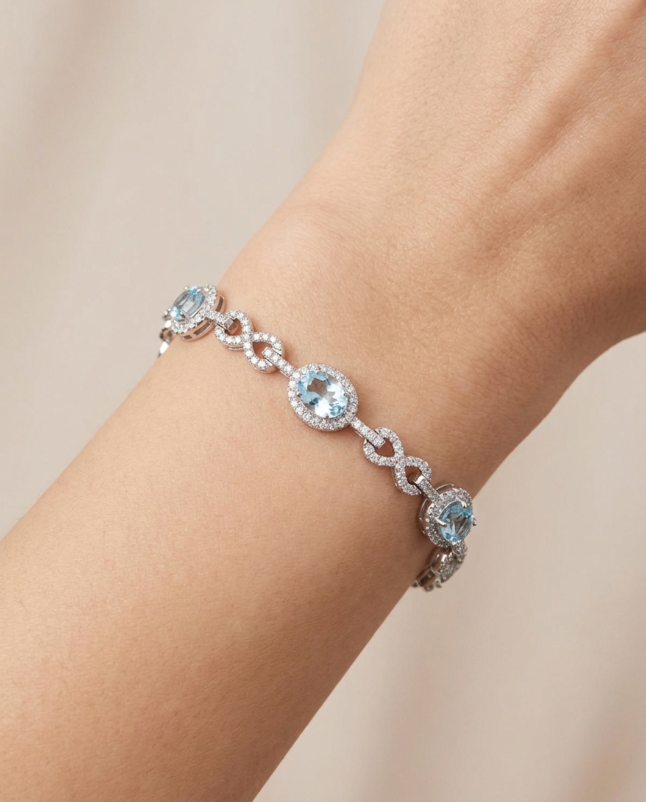 14KT White Gold Aquamarine and Diamonds Tennis Bracelet on model