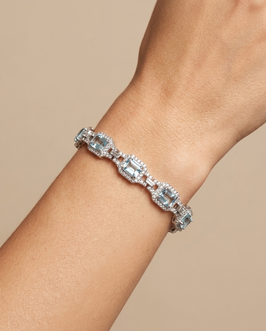 14KT White Gold Aquamarine and Diamonds Tennis Bracelet on model