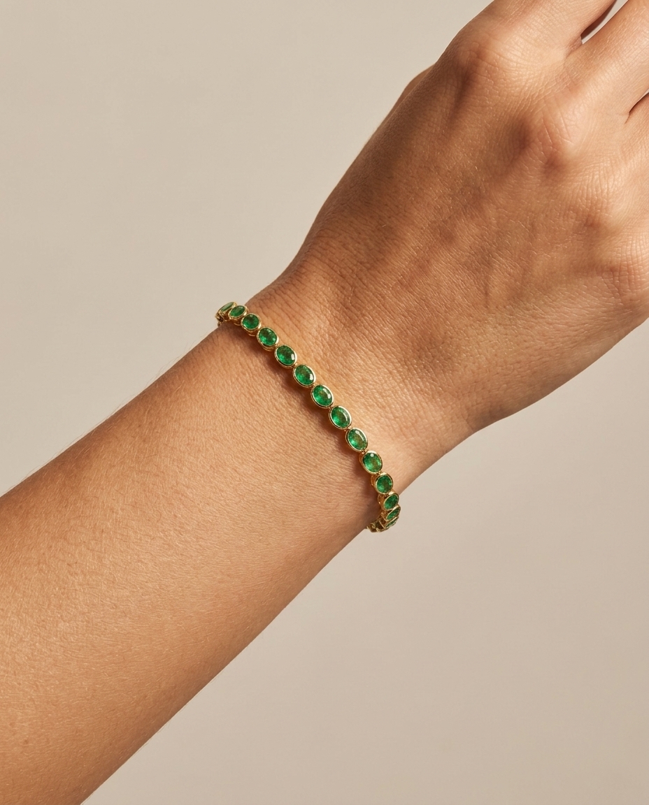 14KT Yellow Gold Oval Shape Bezeled Emerald Bracelet on model