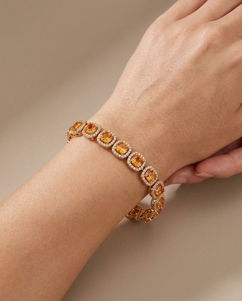 14KT Gold Cushion Shape Orange Sapphire Diamond Bracelet on model