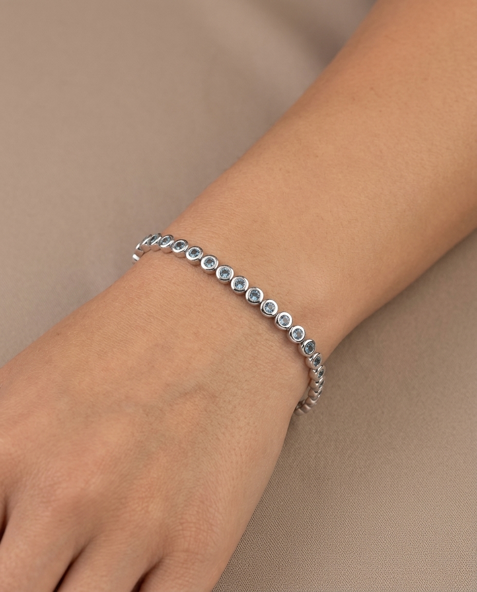14KT White Gold Blue Diamond Bezel Tennis Bracelet on model