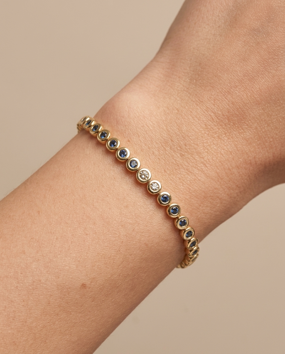 14KT Yellow Gold Blue Diamond Bezel Tennis Bracelet on model