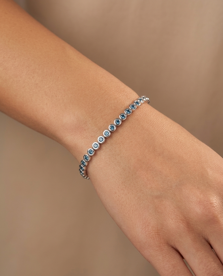 14KT White Gold Blue Diamond Bezel Tennis Bracelet on model