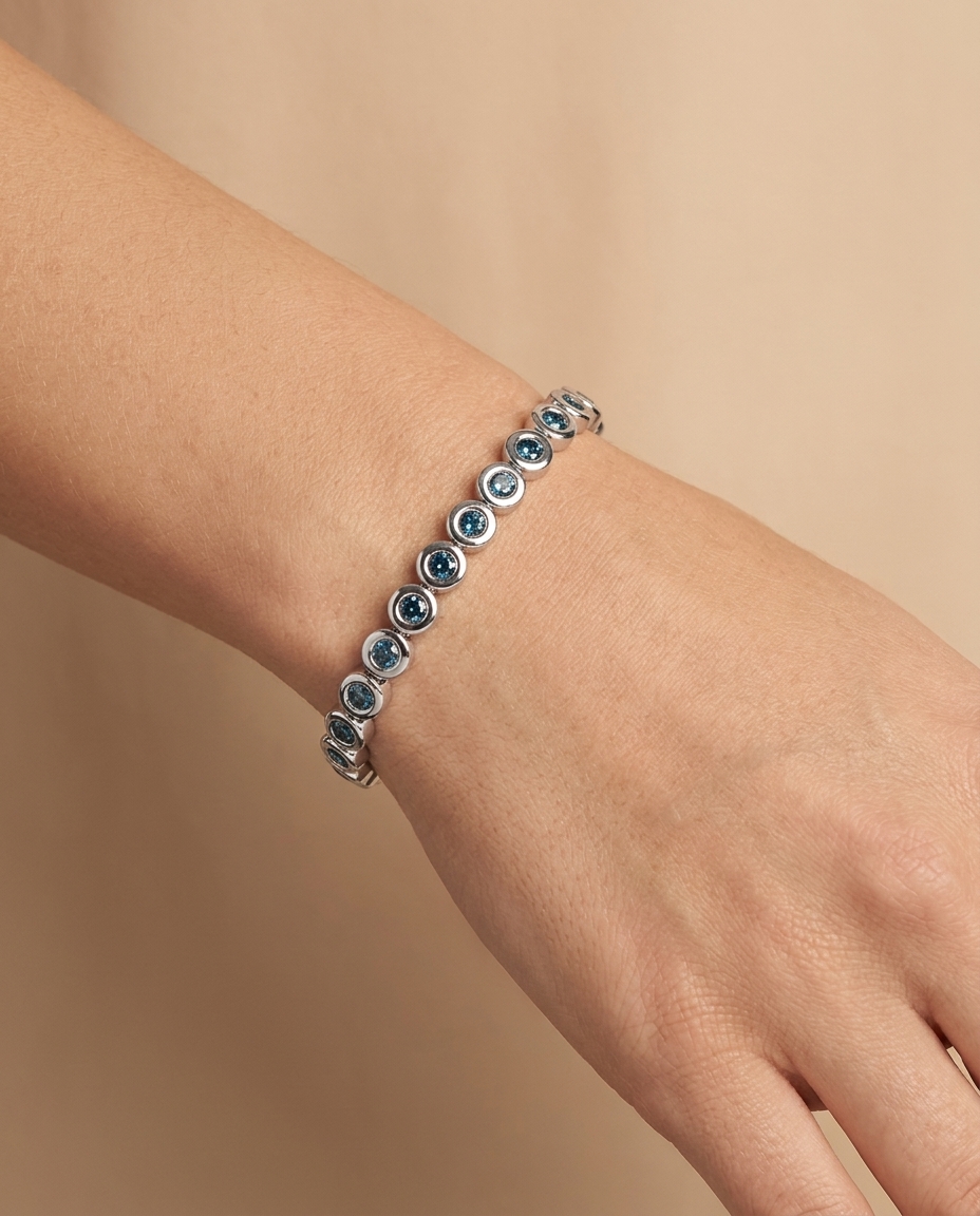 14KT White Gold Blue Diamond Bezel Tennis Bracelet on model