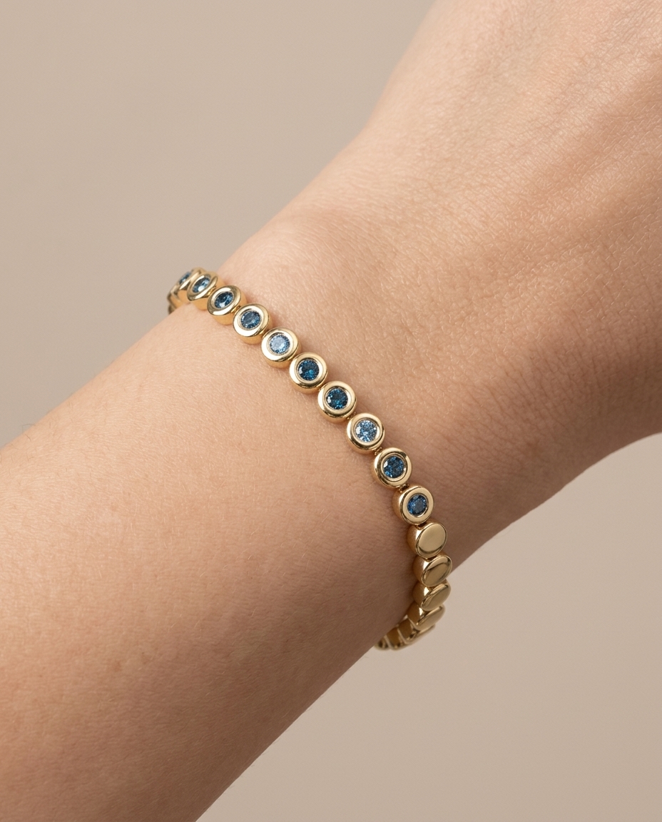 14KT Yellow Gold Blue Diamond Bezel Tennis Bracelet on model
