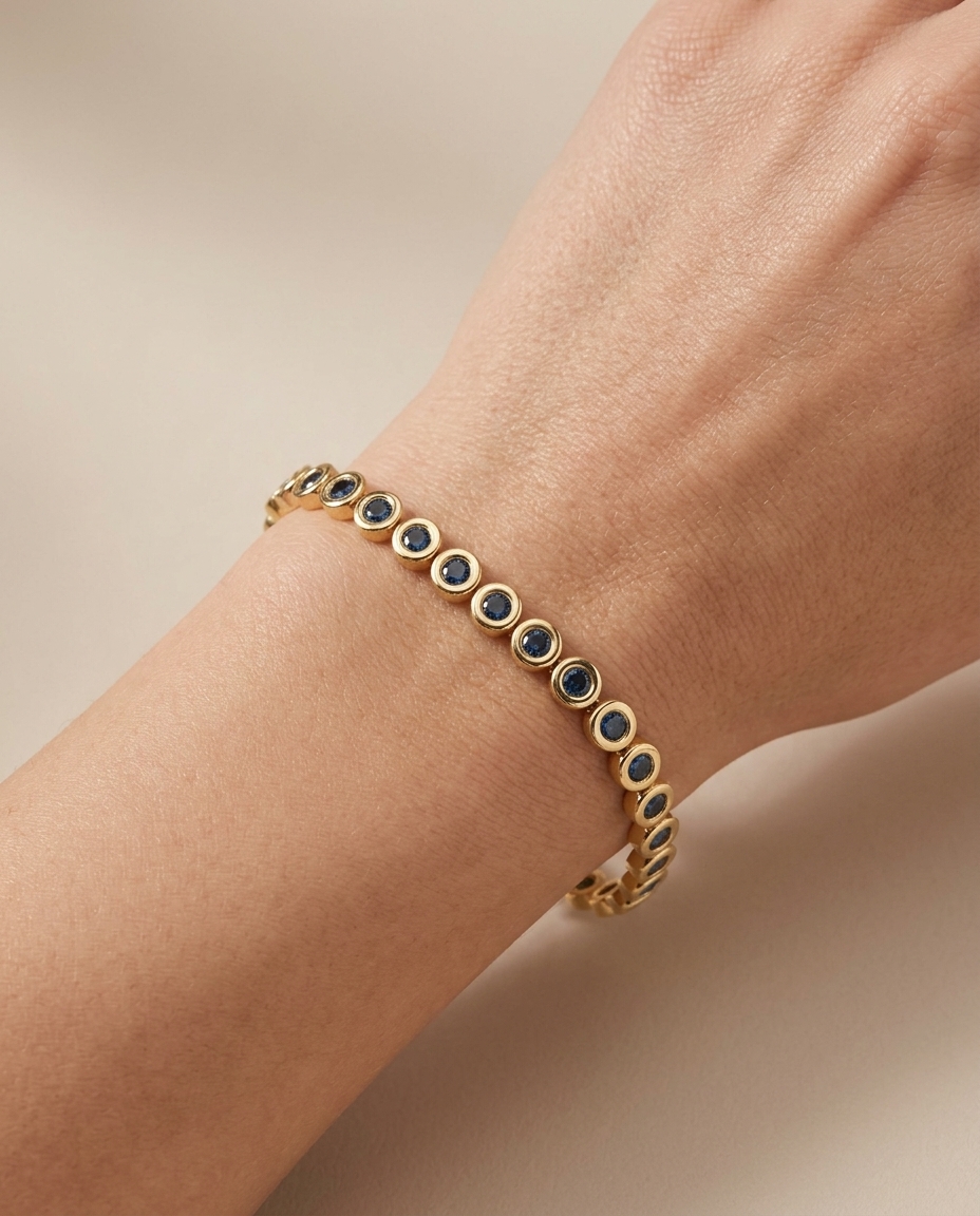 14KT Yellow Gold Blue Diamond Bezel Tennis Bracelet on model