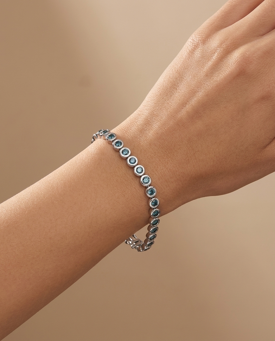 14KT White Gold Blue Diamond Bezel Tennis Bracelet on model