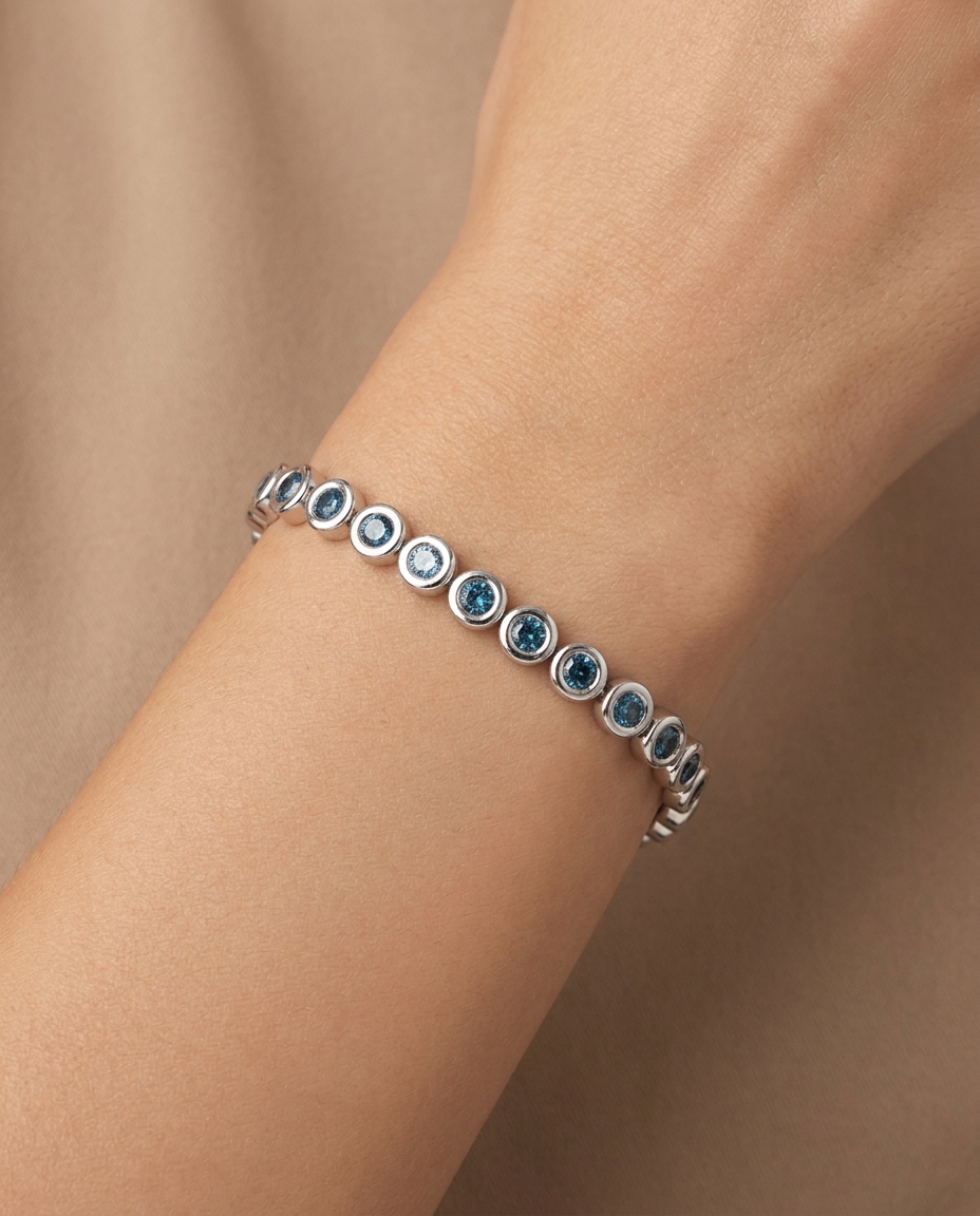 14KT White Gold Blue Diamond Bezel Tennis Bracelet on model