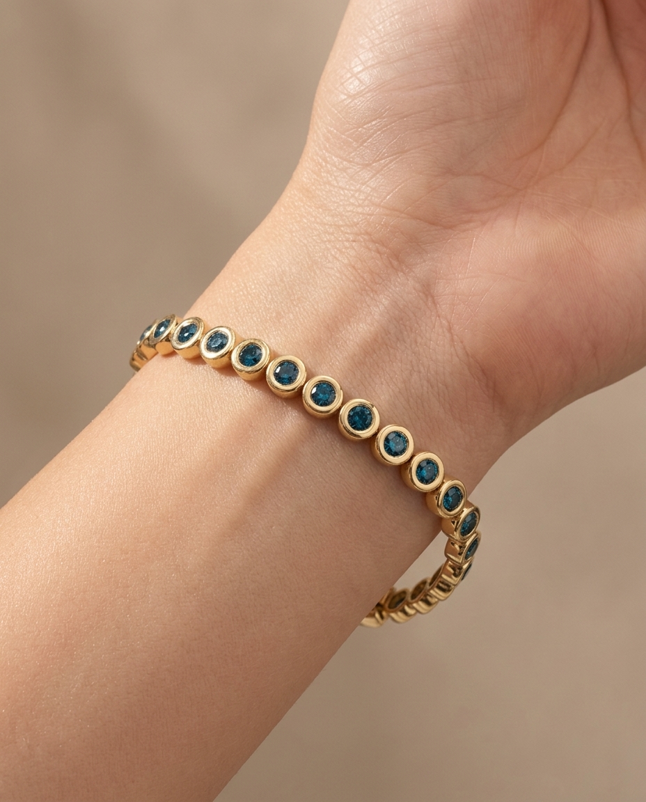 14KT Yellow Gold Blue Diamond Bezel Tennis Bracelet on model