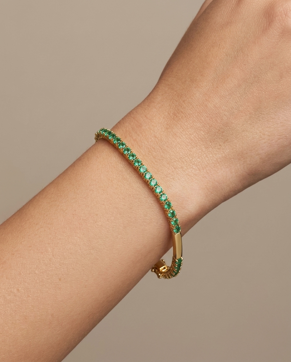 14KT Yellow Gold Emerald Tennis Bracelet on model