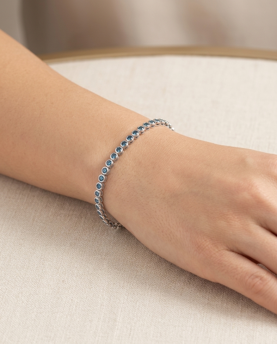 14KT White Gold Blue Diamond Bezel Tennis Bracelet on model