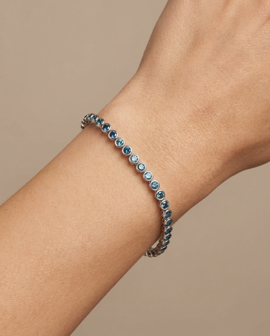14KT White Gold Blue Diamond Bezel Tennis Bracelet on model