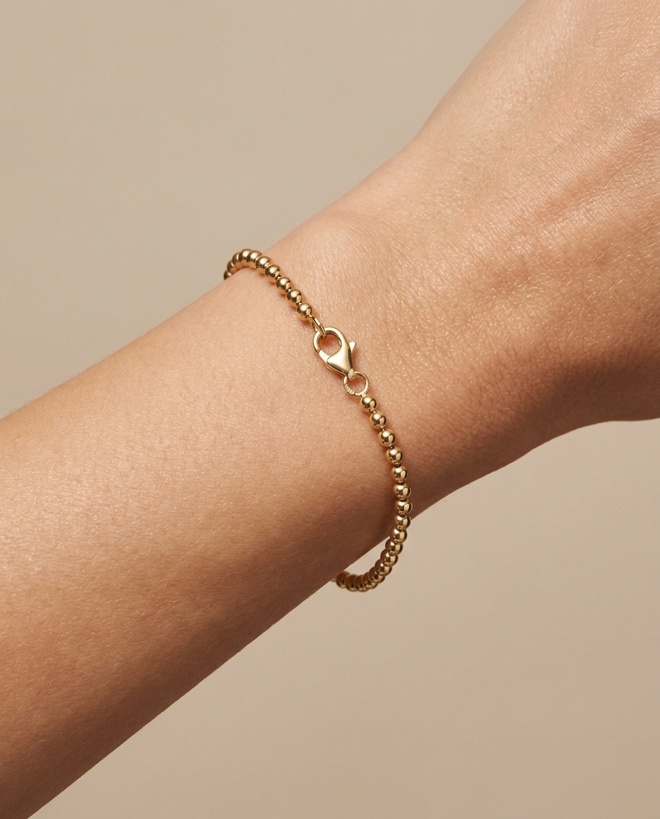 14KT Gold Ball Bracelet on model