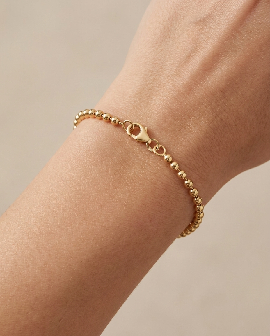 14KT Gold Ball Bracelet on model
