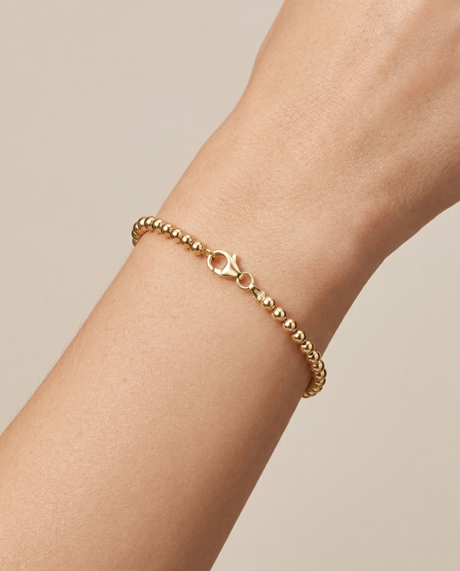 14KT Gold Ball Bracelet on model