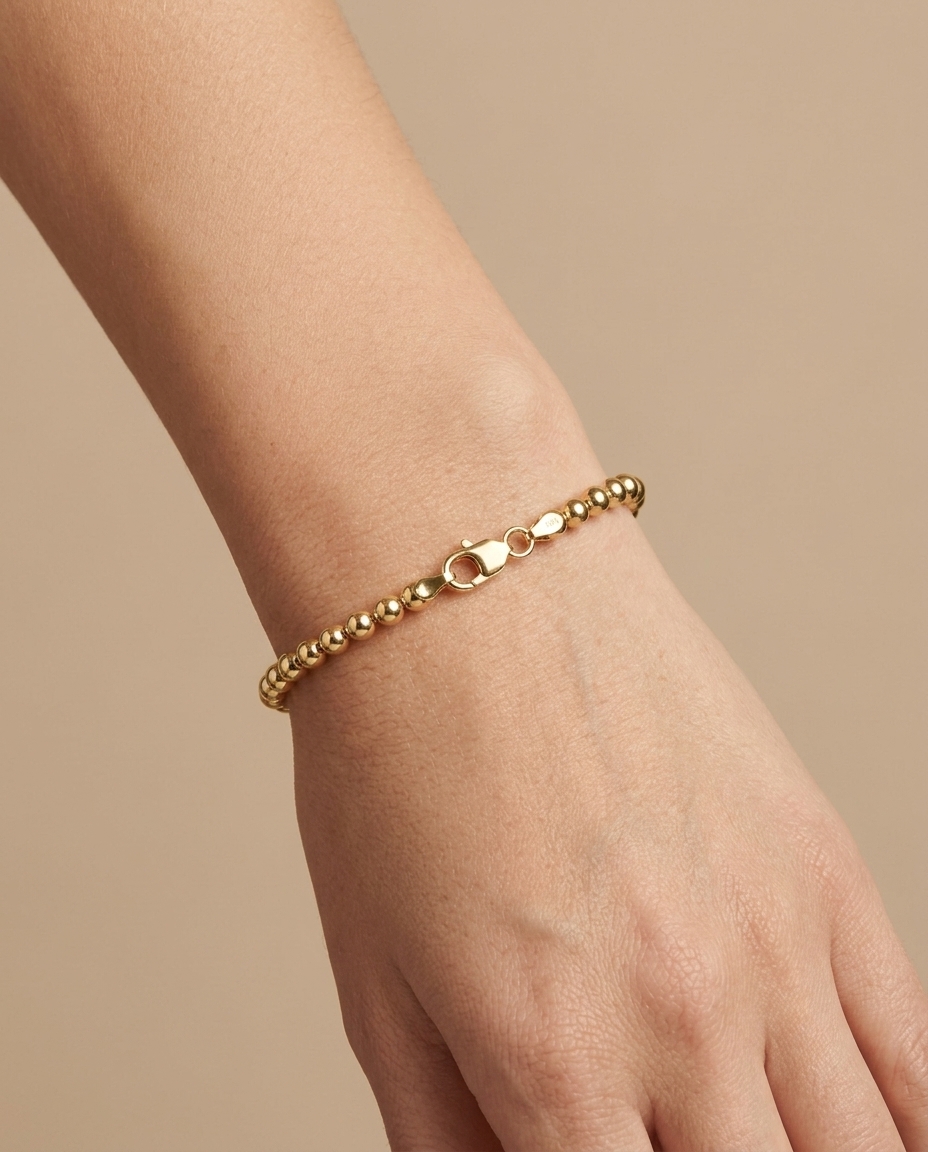 14KT Gold Ball Bracelet on model
