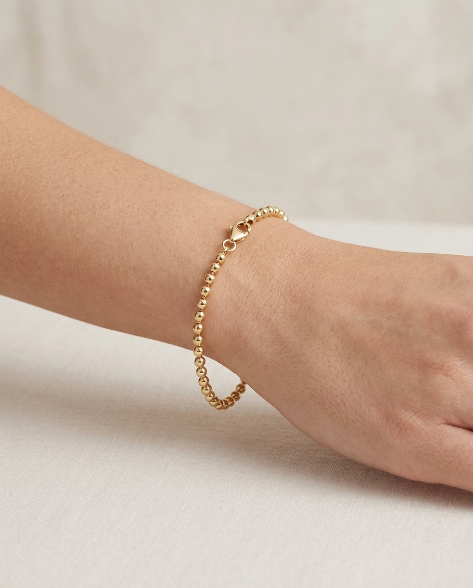 14KT Gold Ball Bracelet on model