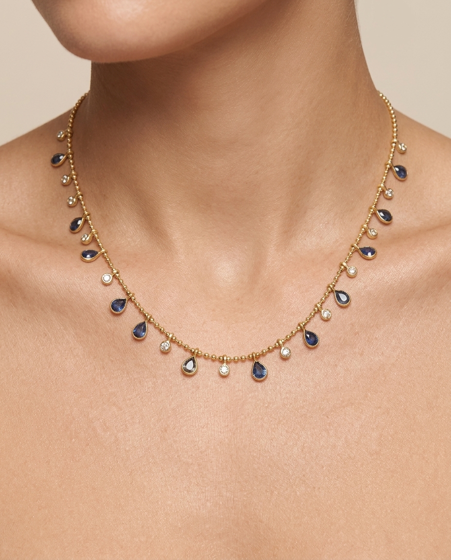 14KT Yellow Gold Pear Shape Sapphire and Diamond Dangling Necklace on model