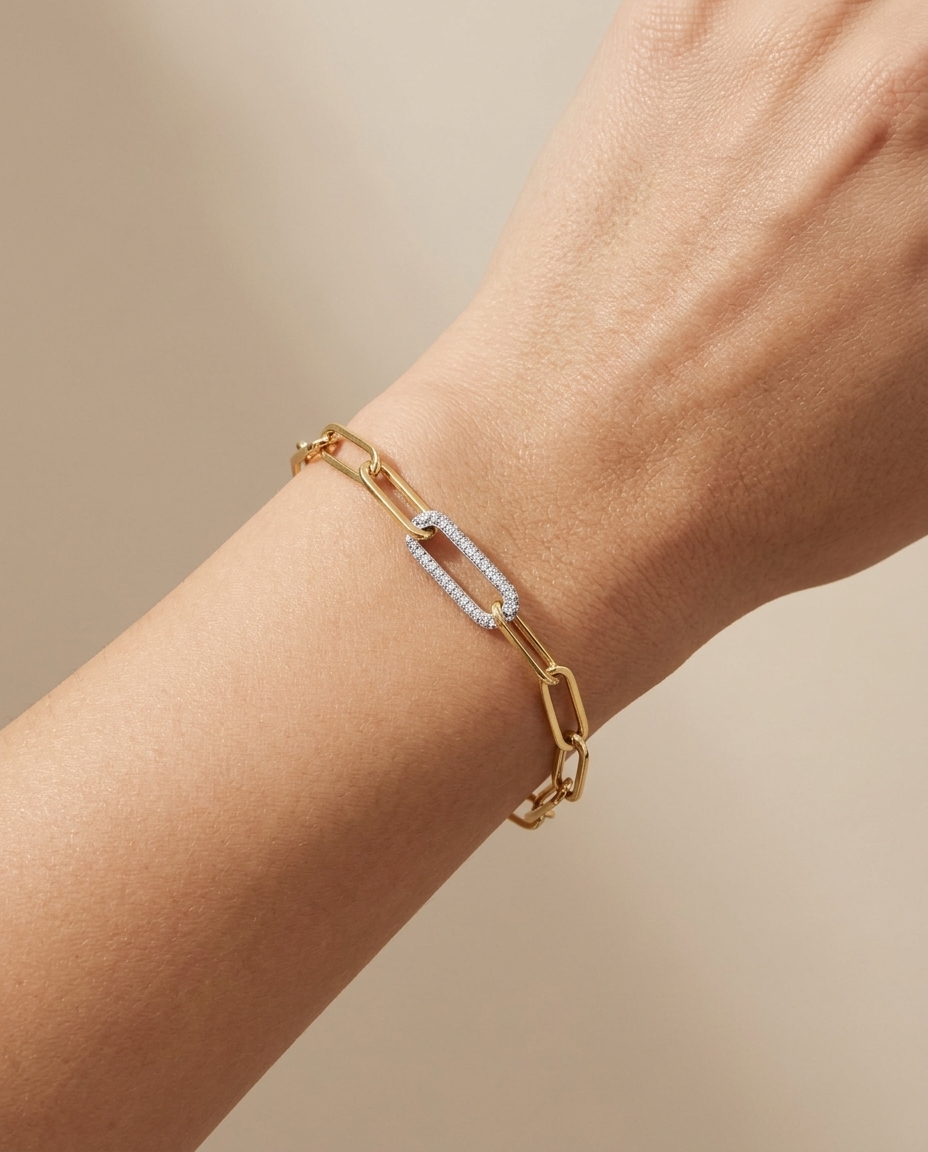 14KT Gold Paperclip Chain with One Diamond Link Bracelet on model