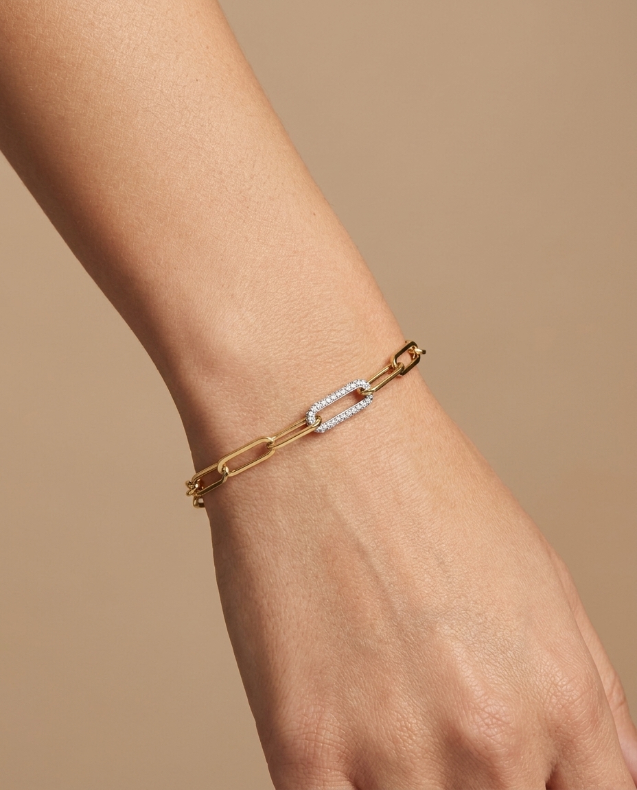 14KT Gold Paperclip Chain with One Diamond Link Bracelet on model