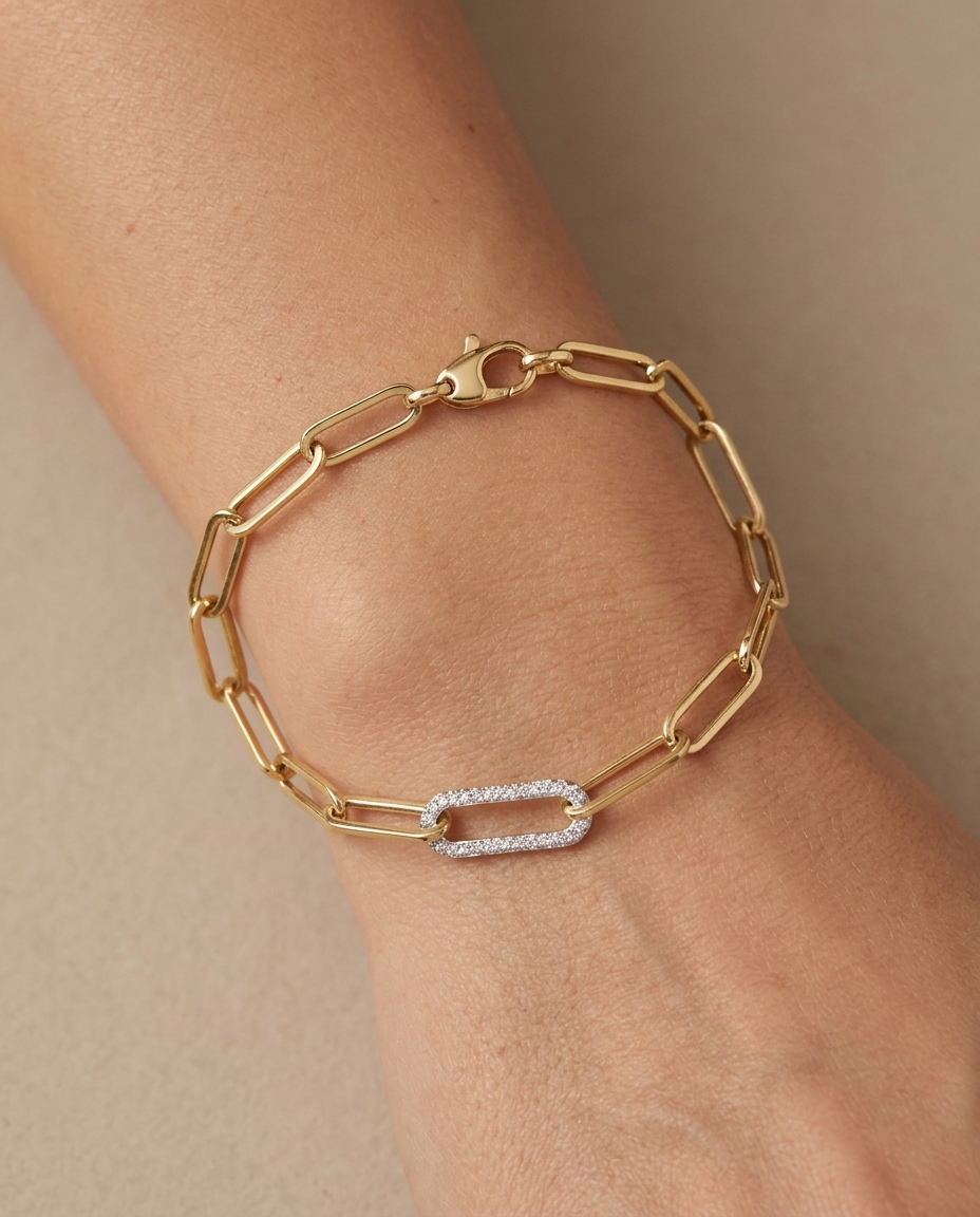 14KT Gold Paperclip Chain with One Diamond Link Bracelet on model