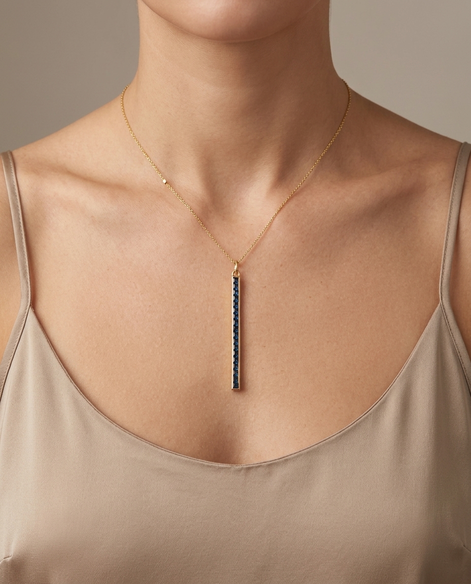 14KT Yellow Gold Blue Sapphire Spike Pendant on model