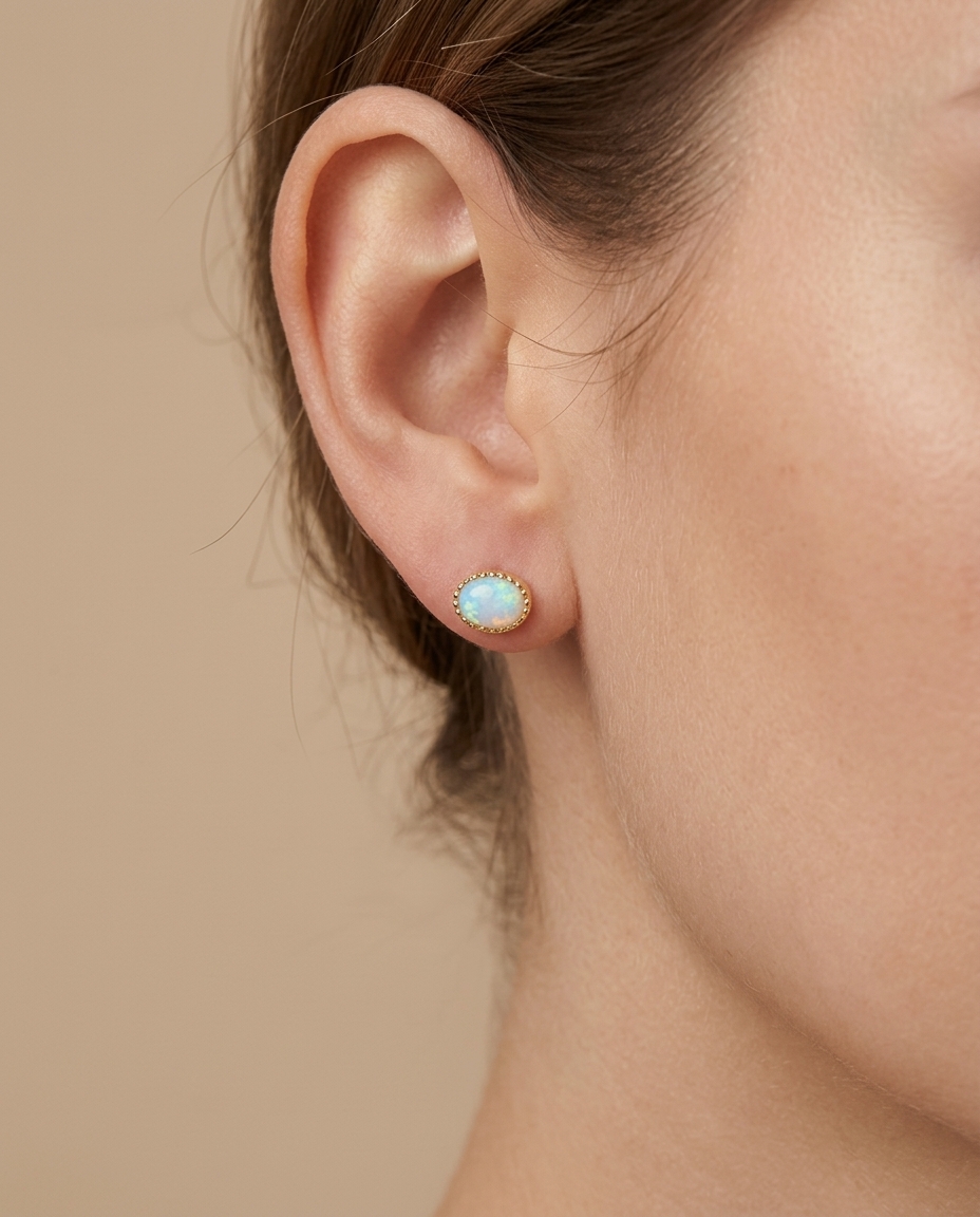 14KT Yellow Gold Oval Shape Opal Earring Studs on model