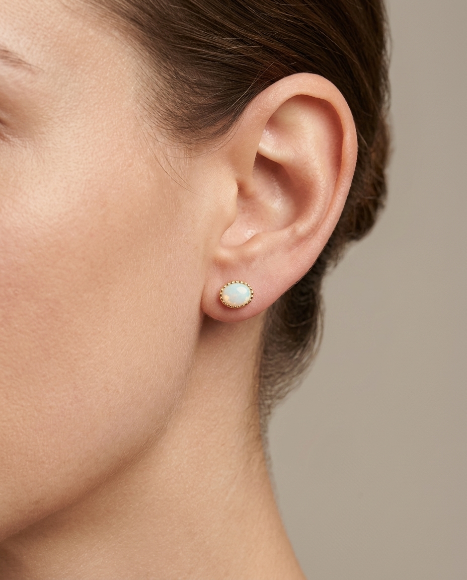 14KT Yellow Gold Oval Shape Opal Earring Studs on model