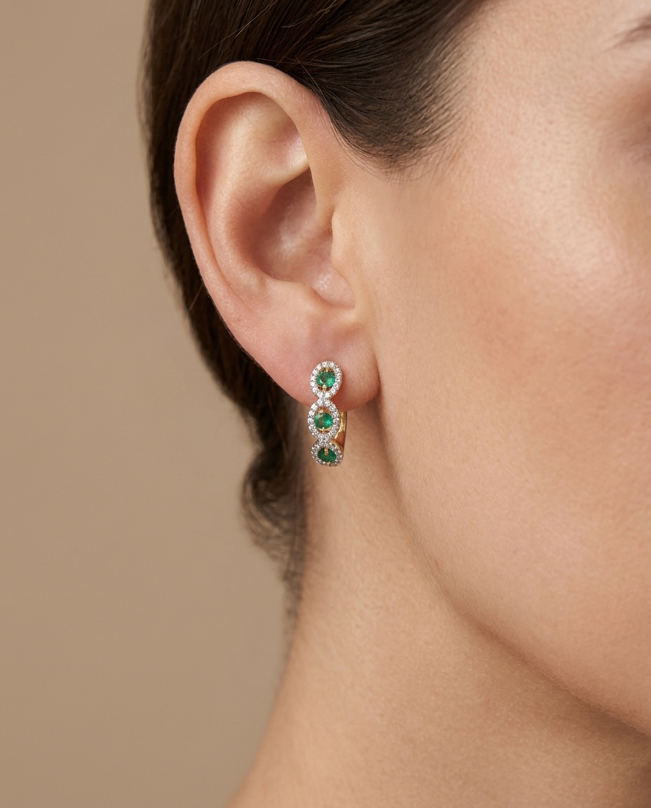 14KT Yellow Gold Diamond and Emerald Huggies Earring on model