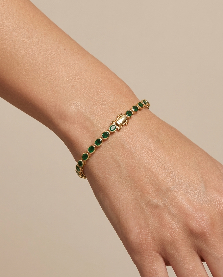 14KT Yellow Gold Oval Shape Bezeled Emerald Bracelet on model