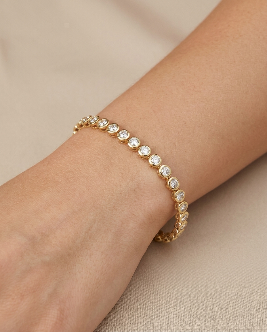 14KT Yellow Gold Diamond Round Bezel Set Tennis Bracelet on model