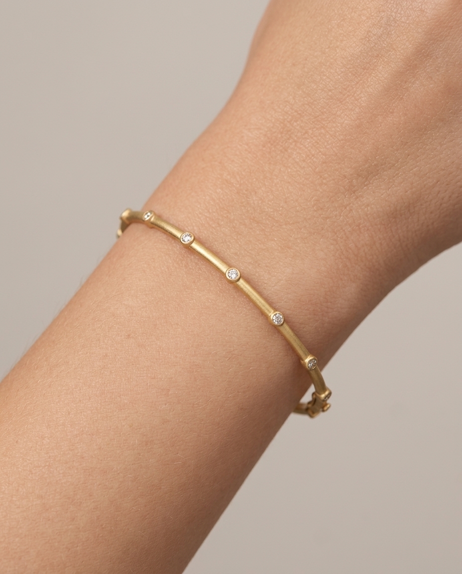 18KT Gold Diamond Bangle with Matte Finish on model
