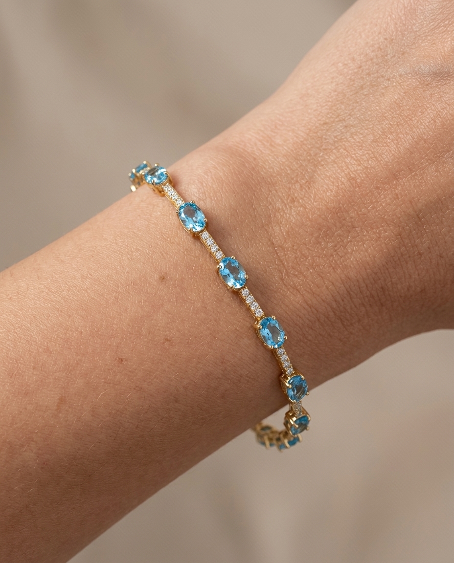 14KT Gold Blue Topaz and Diamonds Bracelet on model