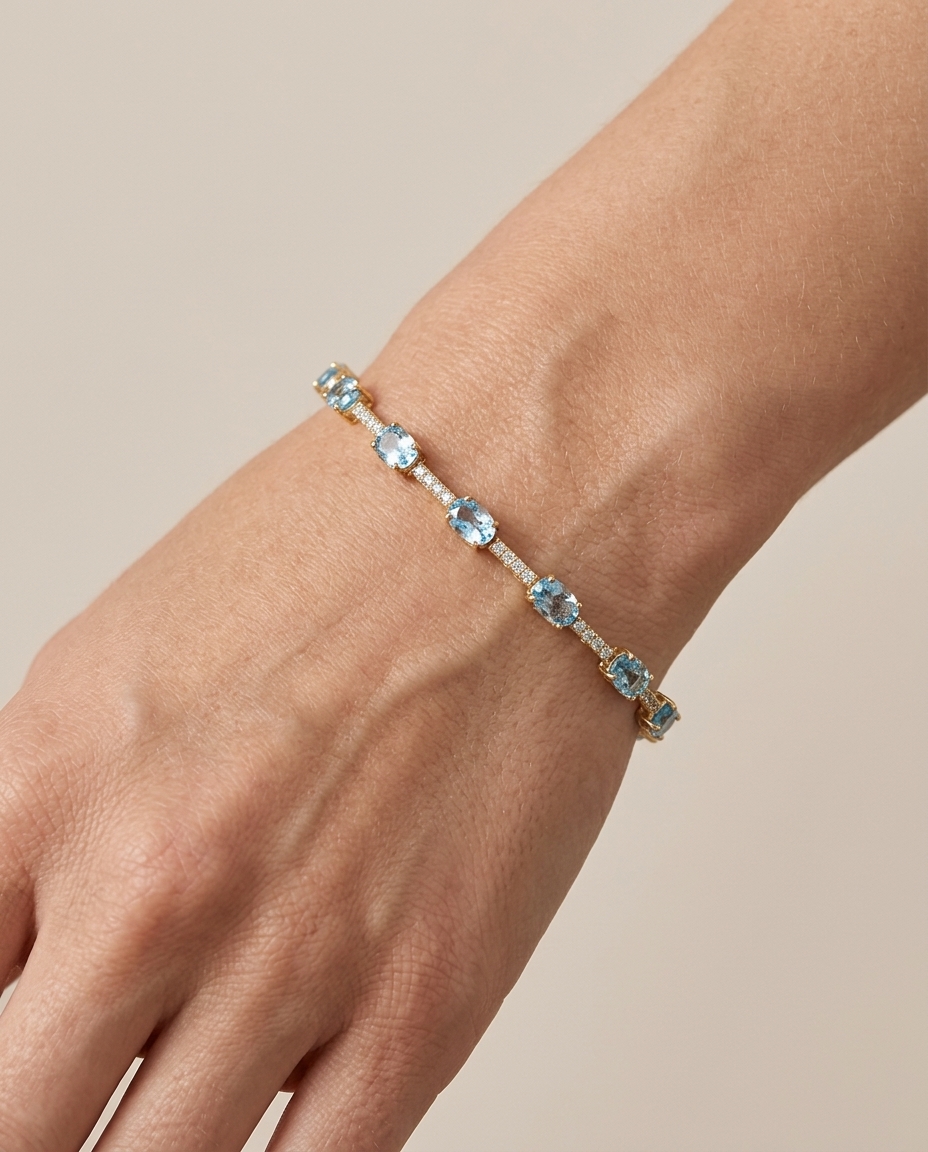 14KT Gold Blue Topaz and Diamonds Bracelet on model