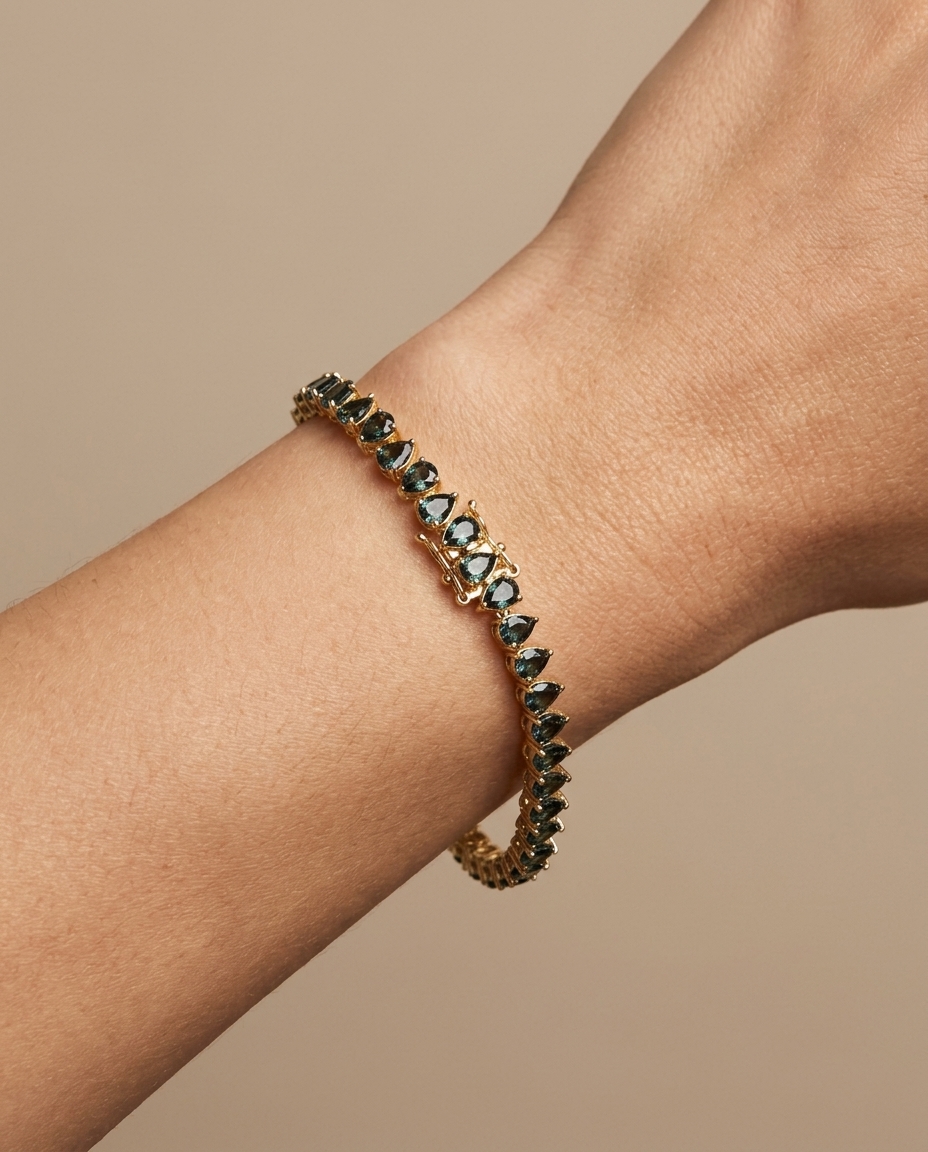 14KT Gold Pear Shape Blue Sapphire Bracelet on model