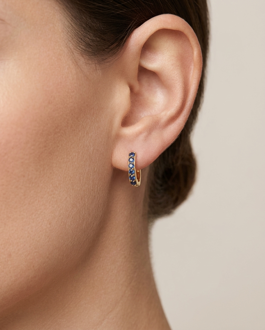 14KT Yellow Gold Blue Sapphire Earing on model