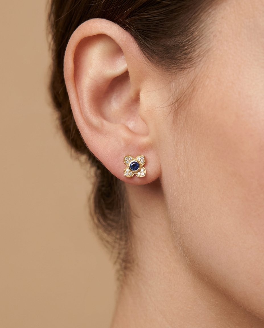 14KT Gold Blue Sapphire Flower Earring on model
