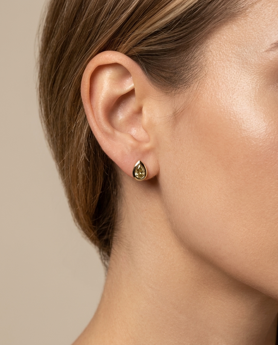 14KT Yellow Gold Pear Diamond Bezel Earring Studs on model