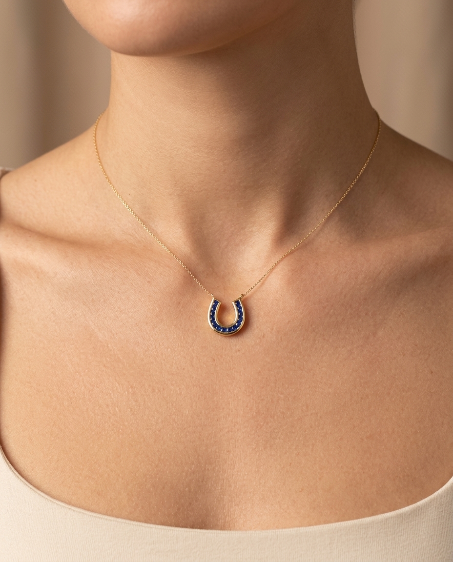 14KT Yellow Gold Blue Sapphire Horseshoe Pendant on model