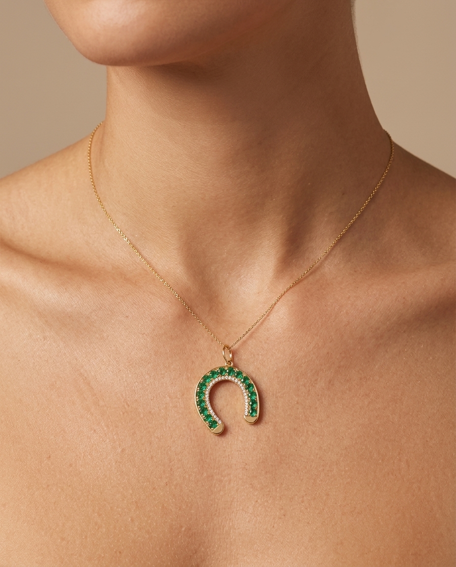 14KT Gold Emerald Horseshoe Pendant on model